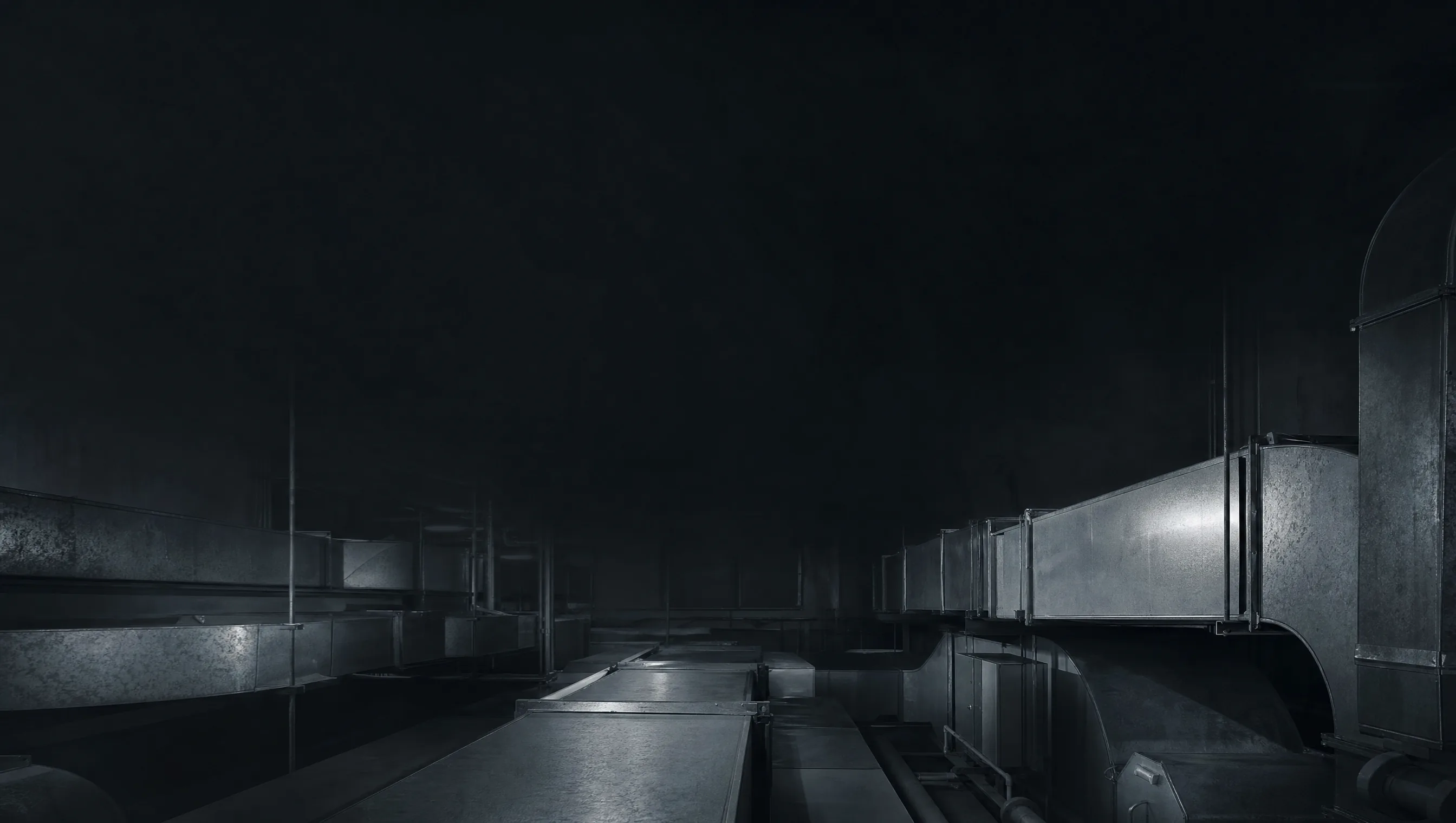 Dark plant room with sheet metal ductwork